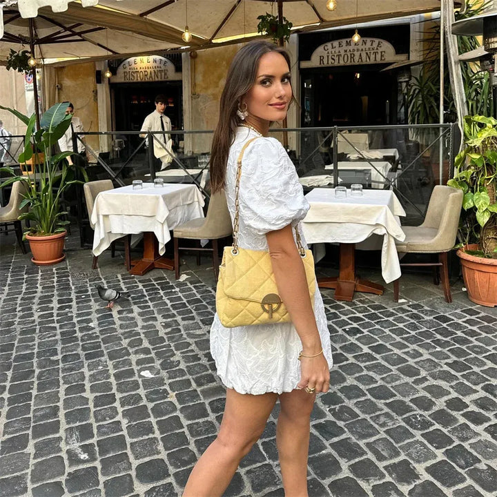 Elegante witte broderie jurk met pofmouwen – Lydia